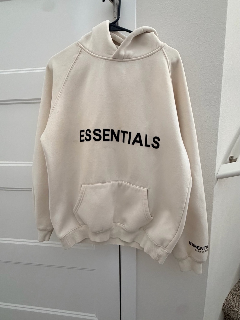 Essentials Cream Pullover Hoodie with Black Logo